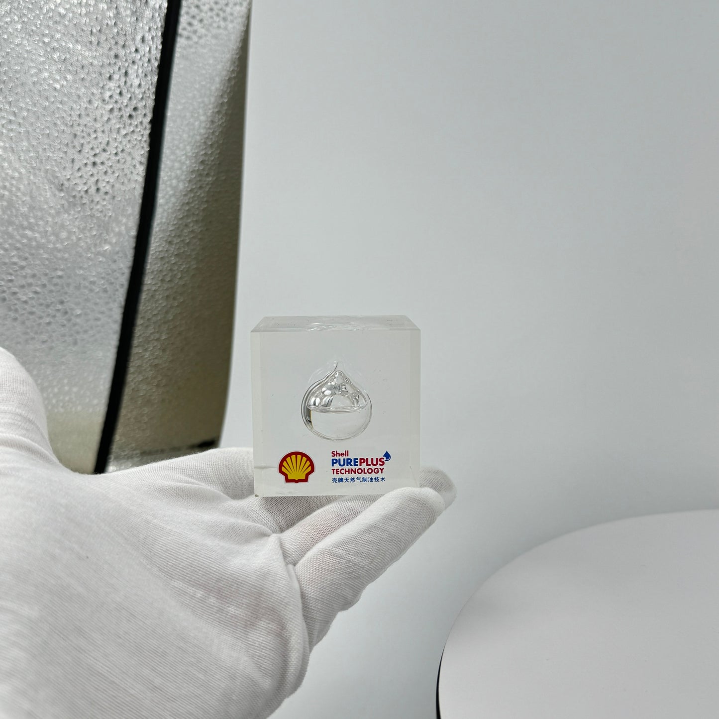 TRANSPARENT PAPER WEIGHT ENCAPSULATED WITH TEAR DROP OIL BOTTLE