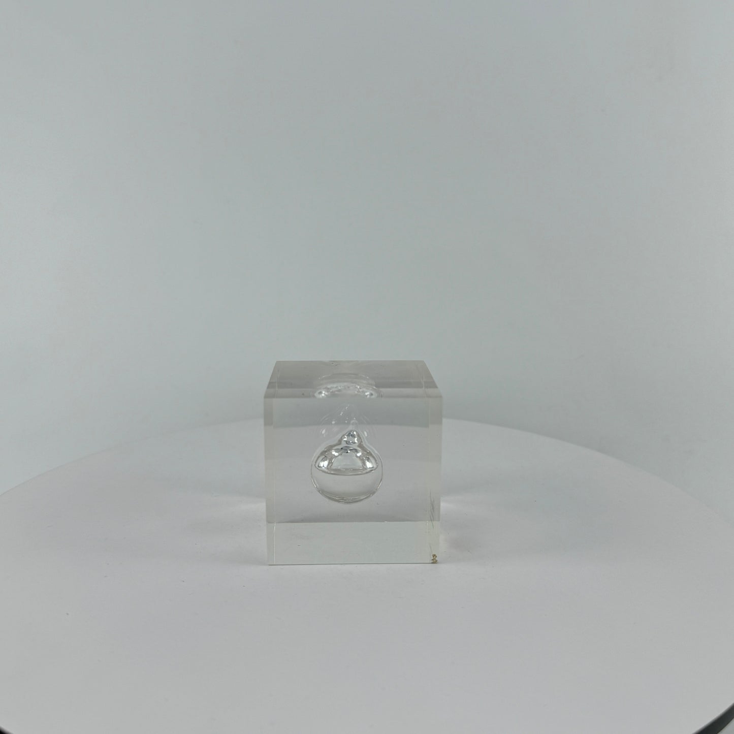 TRANSPARENT PAPER WEIGHT ENCAPSULATED WITH TEAR DROP OIL BOTTLE