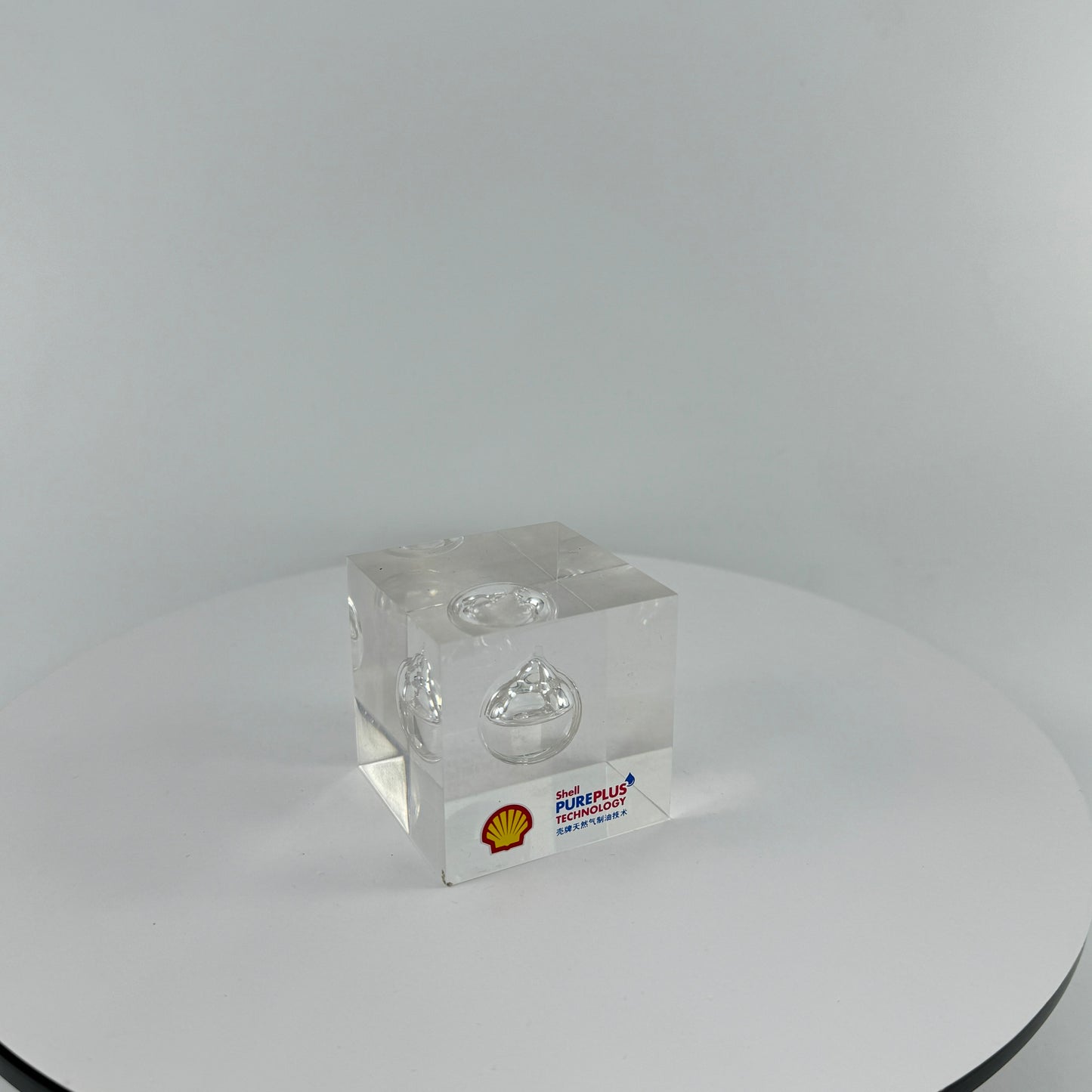 TRANSPARENT PAPER WEIGHT ENCAPSULATED WITH TEAR DROP OIL BOTTLE