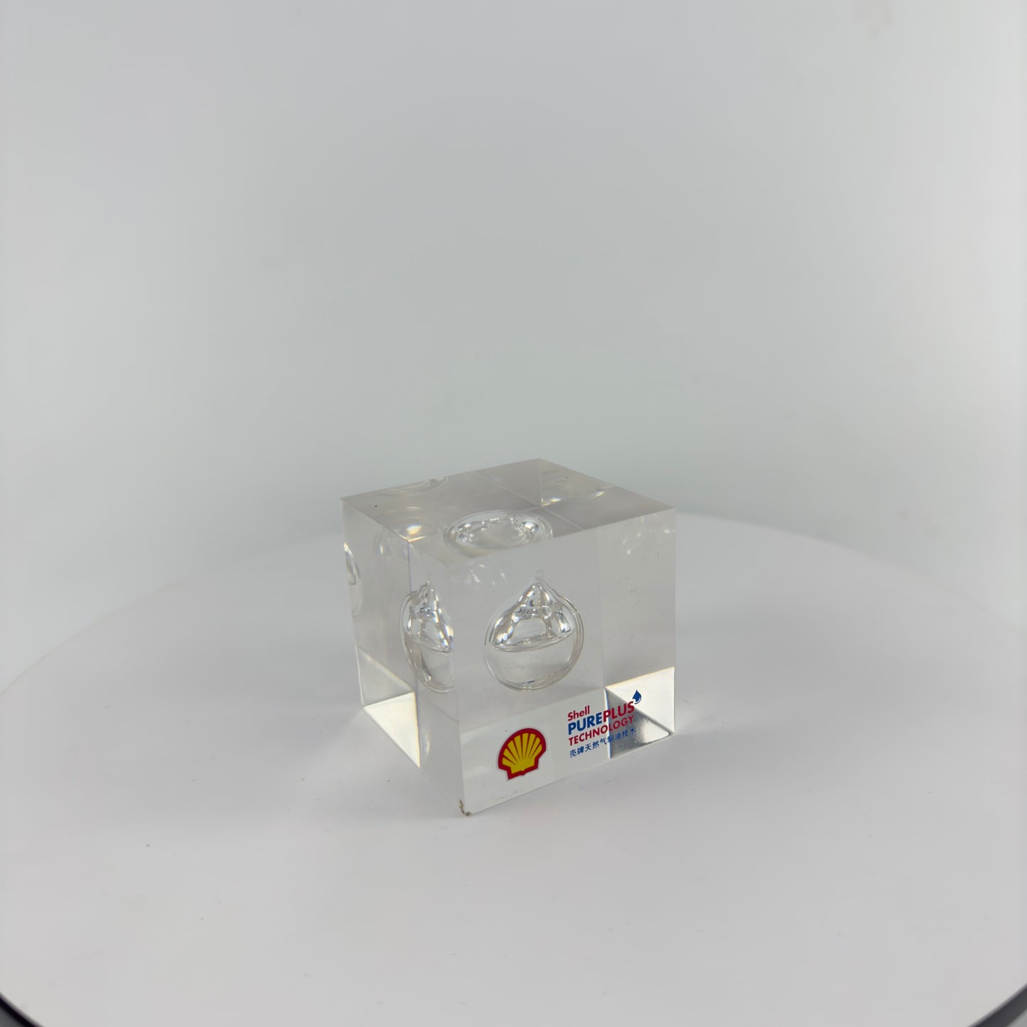 TRANSPARENT PAPER WEIGHT ENCAPSULATED WITH TEAR DROP OIL BOTTLE