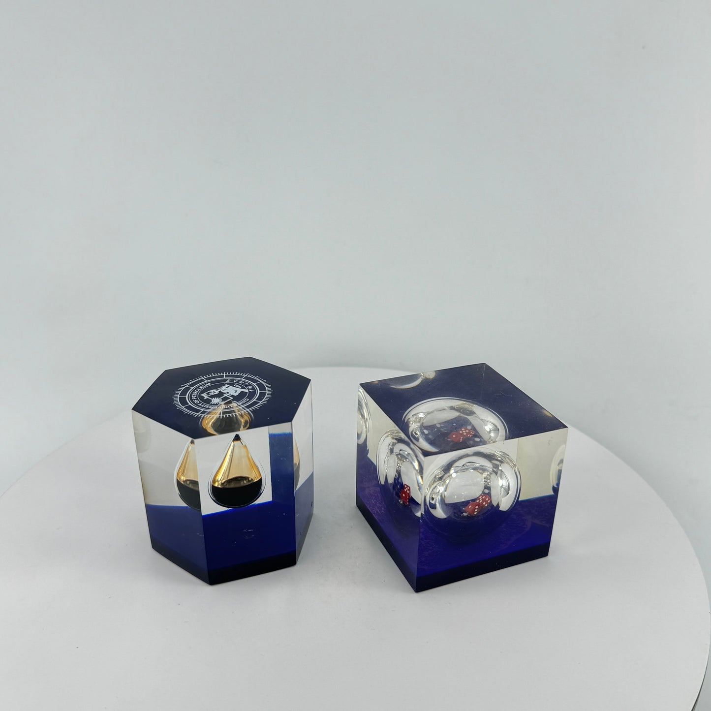 TRANSPARENT PAPER WEIGHT ENCAPSULATED WITH TEAR DROP OIL BOTTLE
