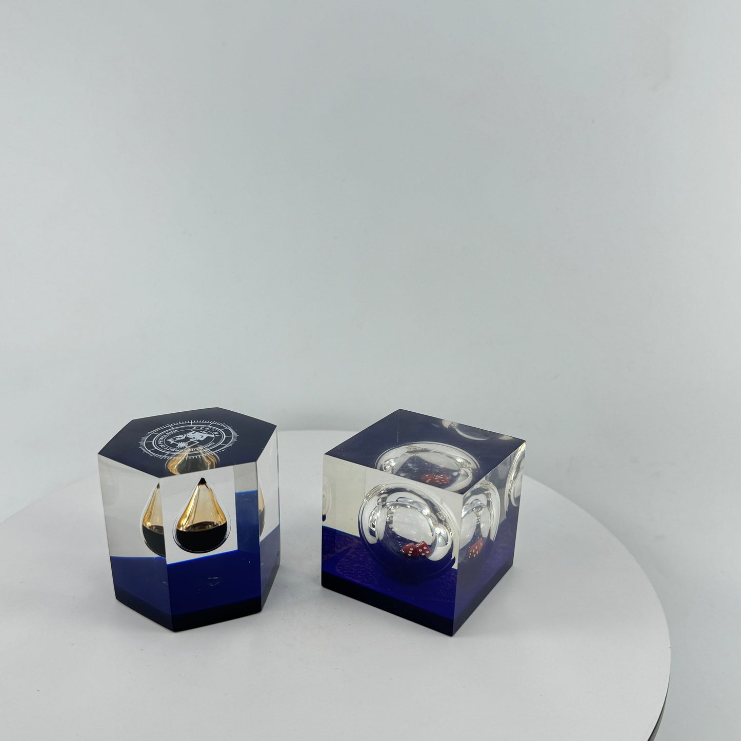TRANSPARENT PAPER WEIGHT ENCAPSULATED WITH TEAR DROP OIL BOTTLE