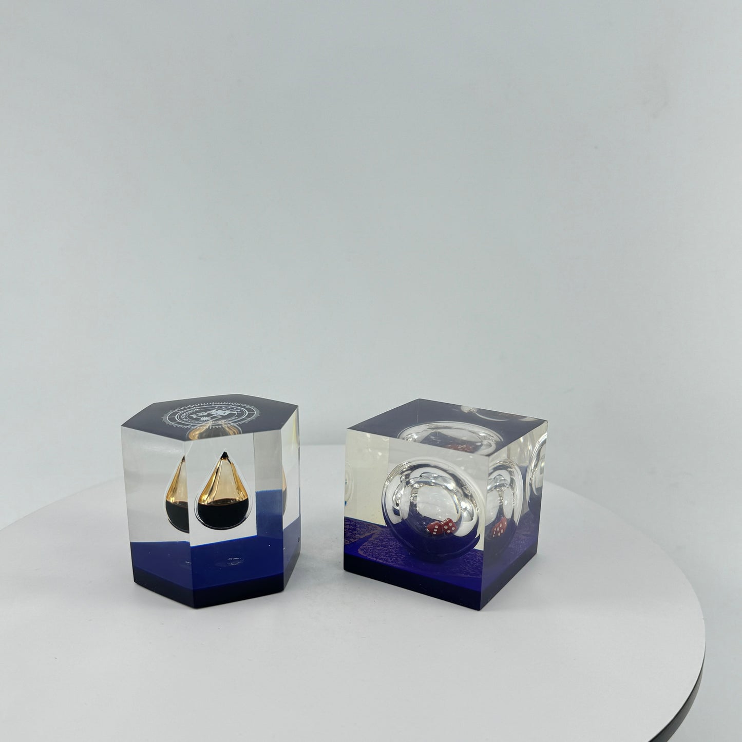 TRANSPARENT PAPER WEIGHT ENCAPSULATED WITH TEAR DROP OIL BOTTLE