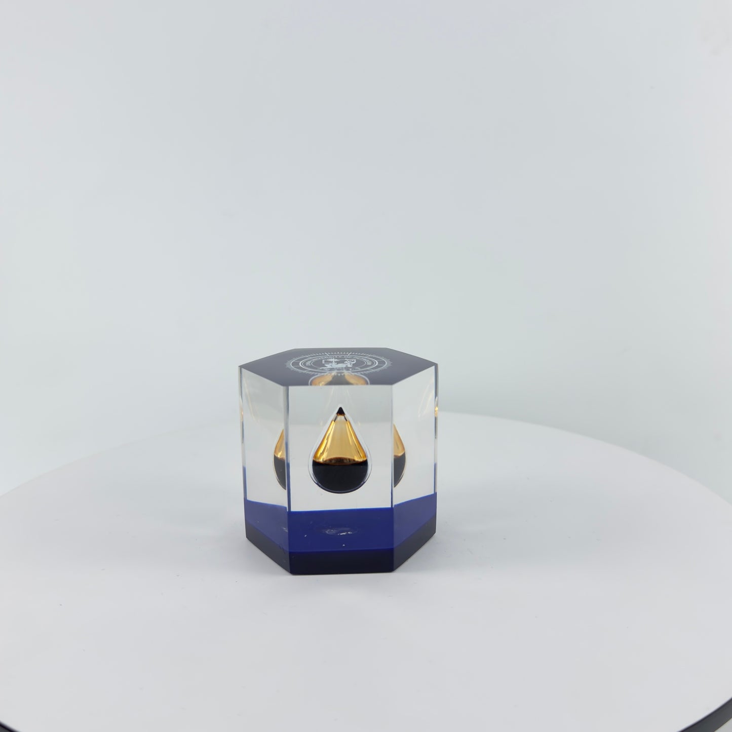 TRANSPARENT PAPER WEIGHT ENCAPSULATED WITH TEAR DROP OIL BOTTLE