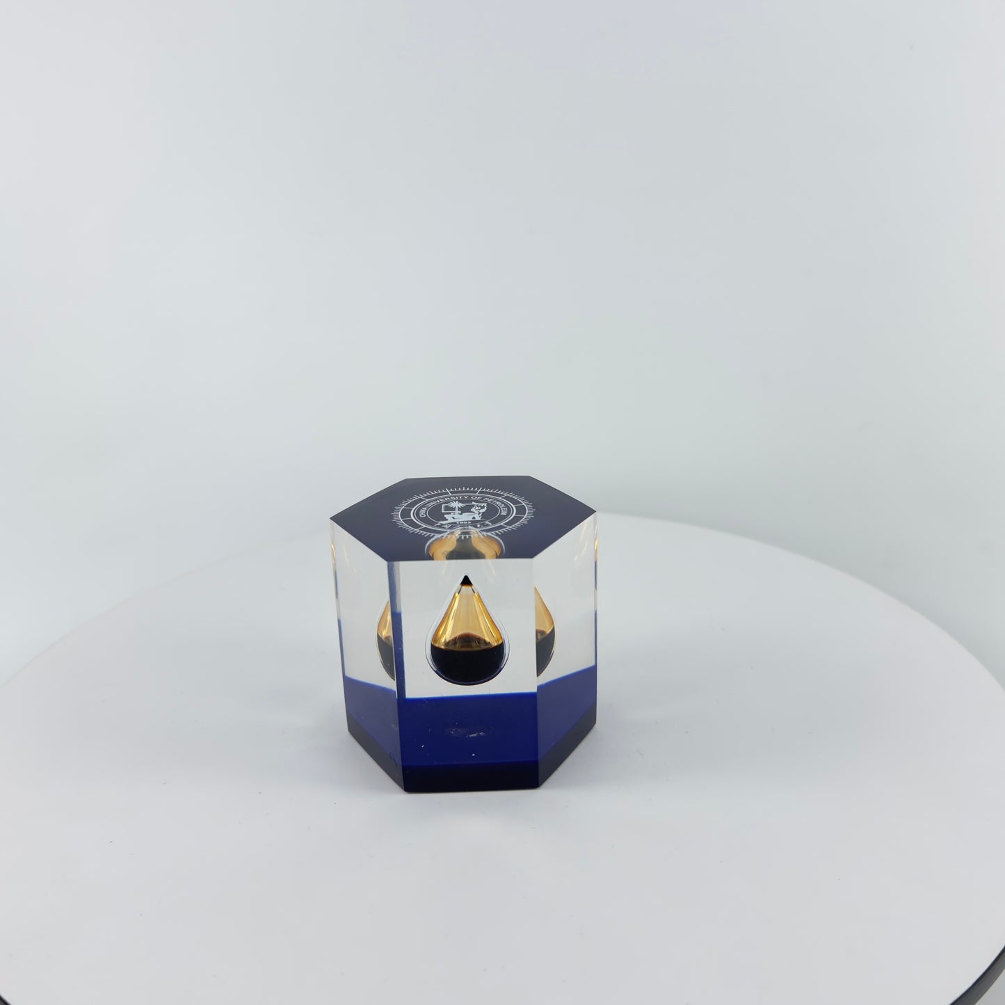 TRANSPARENT PAPER WEIGHT ENCAPSULATED WITH TEAR DROP OIL BOTTLE