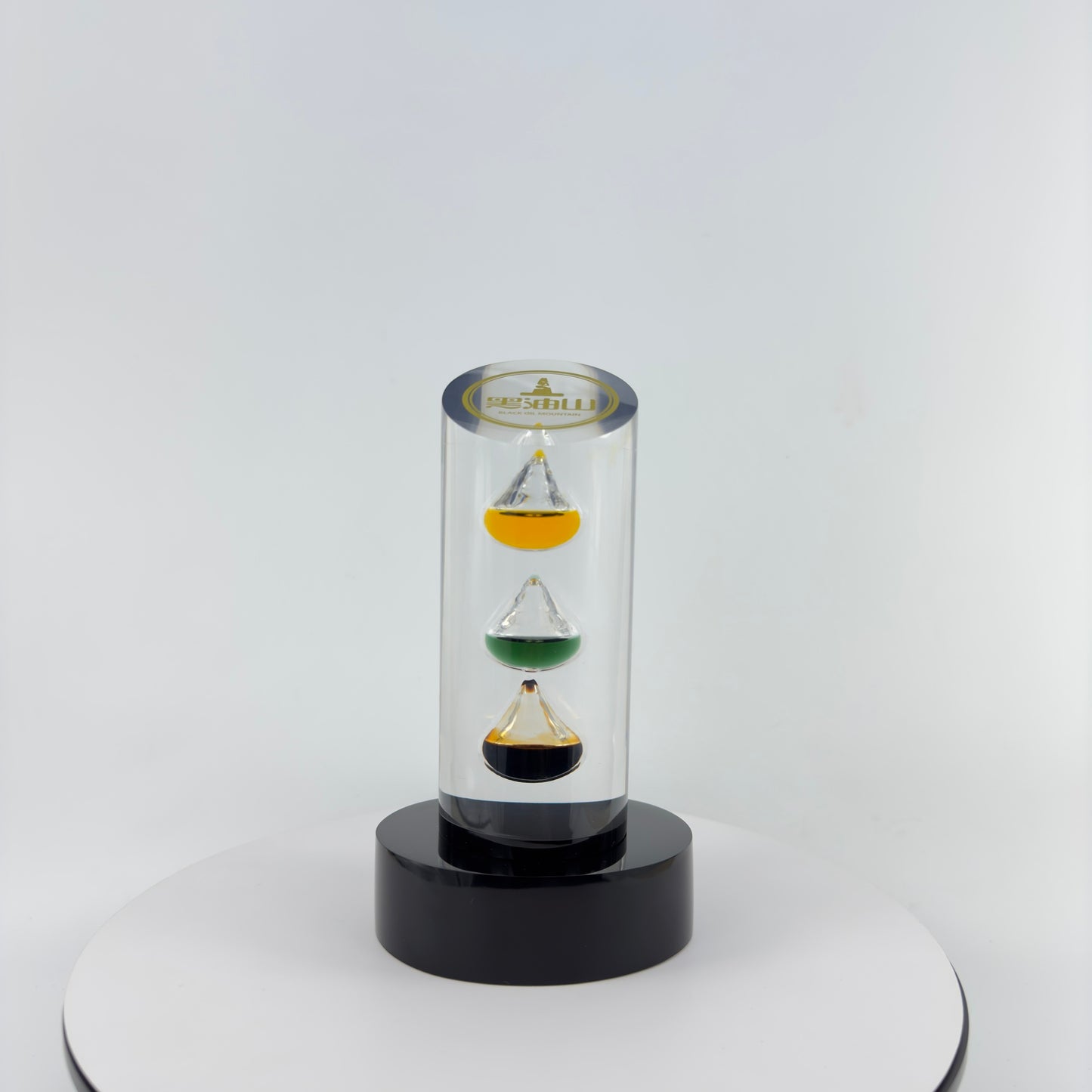 TRANSPARENT PAPER WEIGHT ENCAPSULATED WITH 3 TEAR DROP OIL BOTTLE