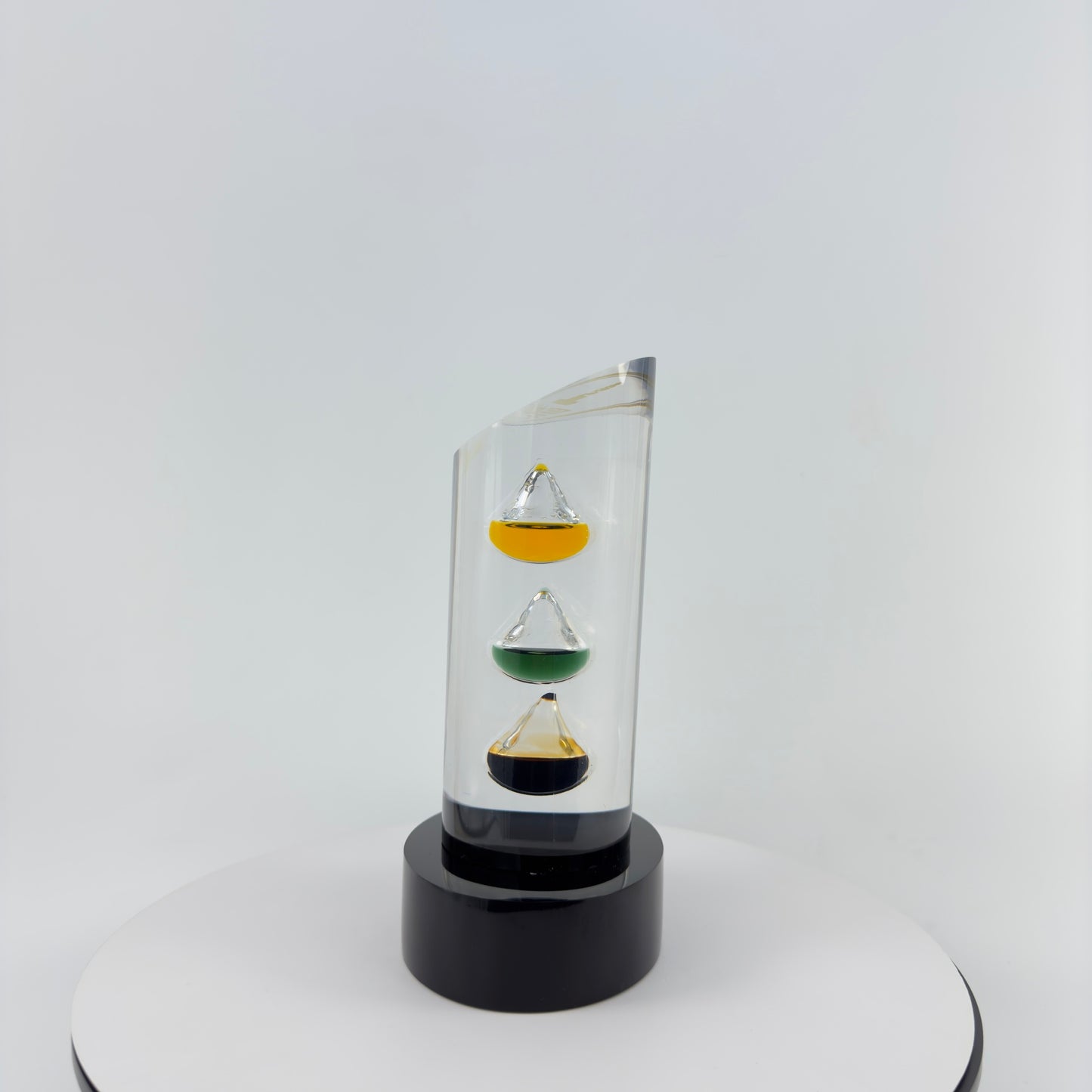 TRANSPARENT PAPER WEIGHT ENCAPSULATED WITH 3 TEAR DROP OIL BOTTLE