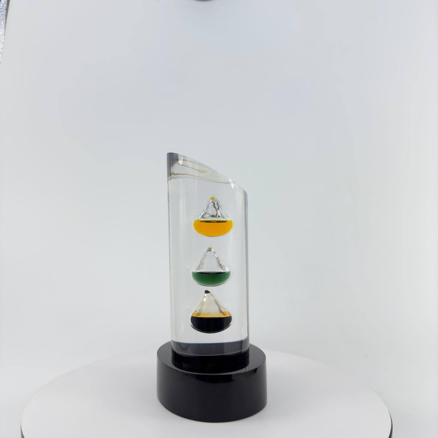 TRANSPARENT PAPER WEIGHT ENCAPSULATED WITH 3 TEAR DROP OIL BOTTLE