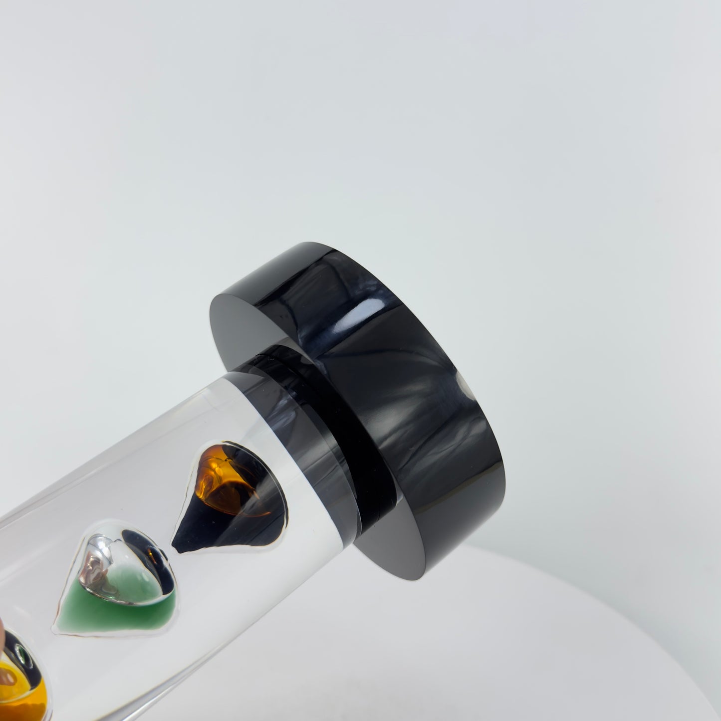 TRANSPARENT PAPER WEIGHT ENCAPSULATED WITH 3 TEAR DROP OIL BOTTLE