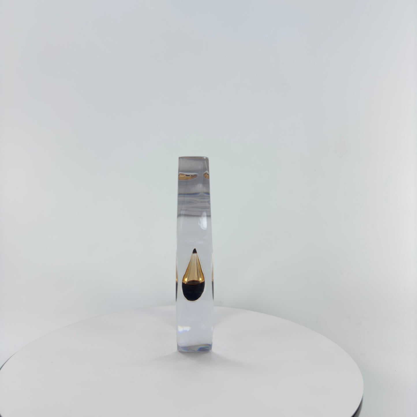 TRANSPARENT PAPER WEIGHT ENCAPSULATED WITH TEAR DROP OIL BOTTLE