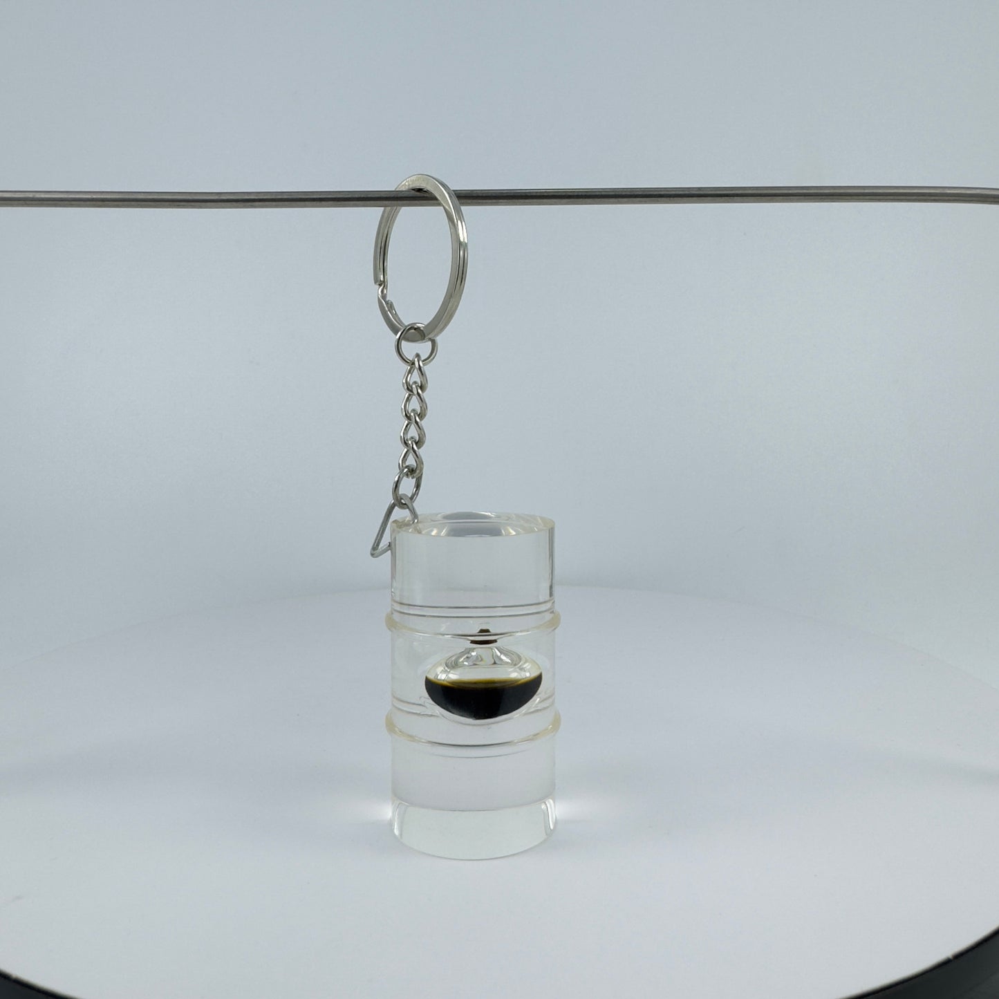 TRANSPARENT KEY CHAIN  ENCAPSULATED WITH TEAR DROP OIL BOTTLE