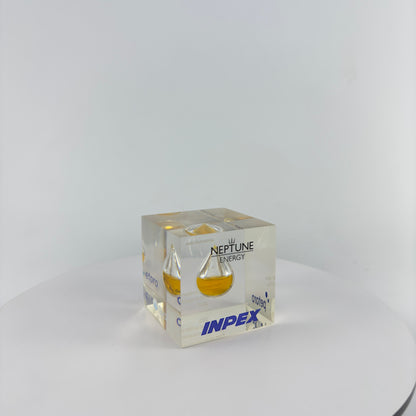TRANSPARENT PAPER WEIGHT ENCAPSULATED WITH TEAR DROP OIL BOTTLE