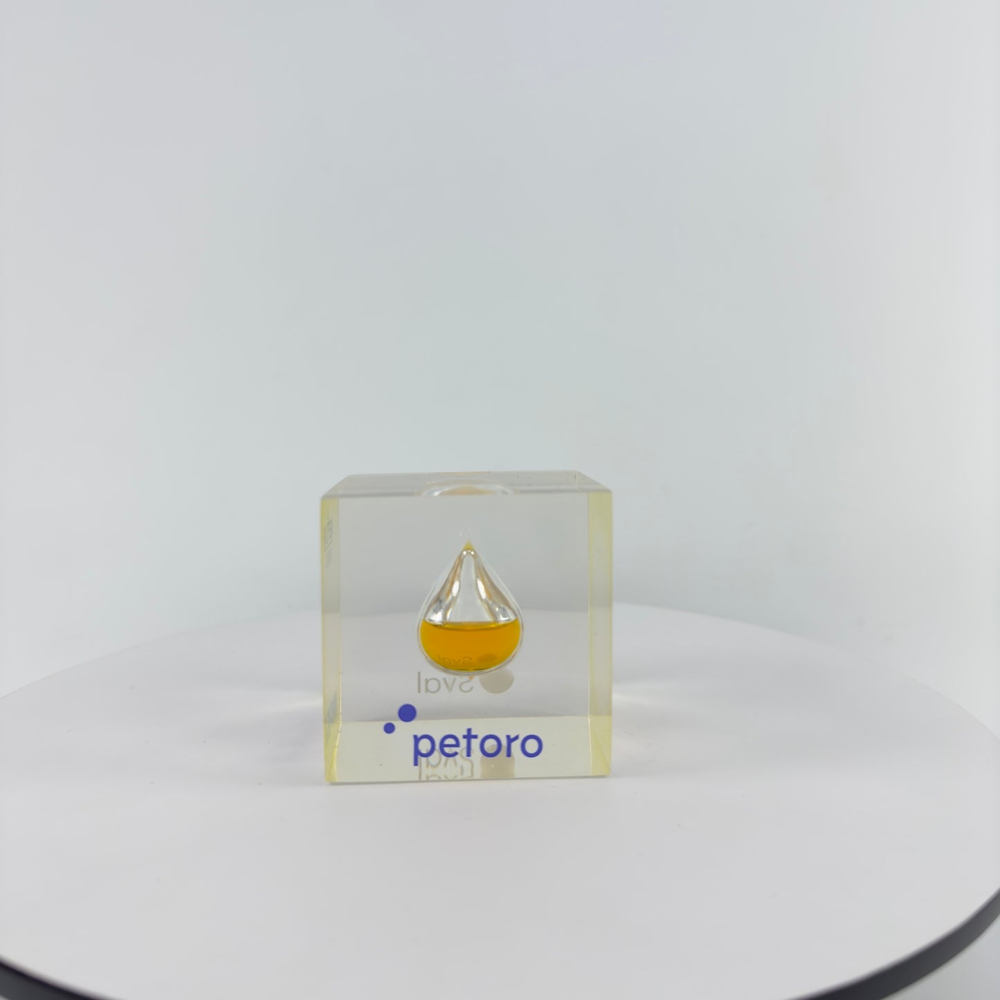 TRANSPARENT PAPER WEIGHT ENCAPSULATED WITH TEAR DROP OIL BOTTLE