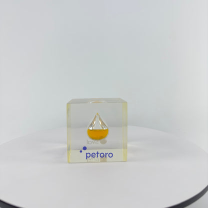 TRANSPARENT PAPER WEIGHT ENCAPSULATED WITH TEAR DROP OIL BOTTLE