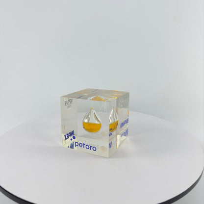 TRANSPARENT PAPER WEIGHT ENCAPSULATED WITH TEAR DROP OIL BOTTLE