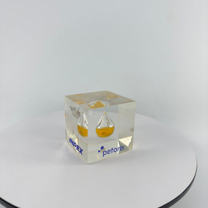 TRANSPARENT PAPER WEIGHT ENCAPSULATED WITH TEAR DROP OIL BOTTLE